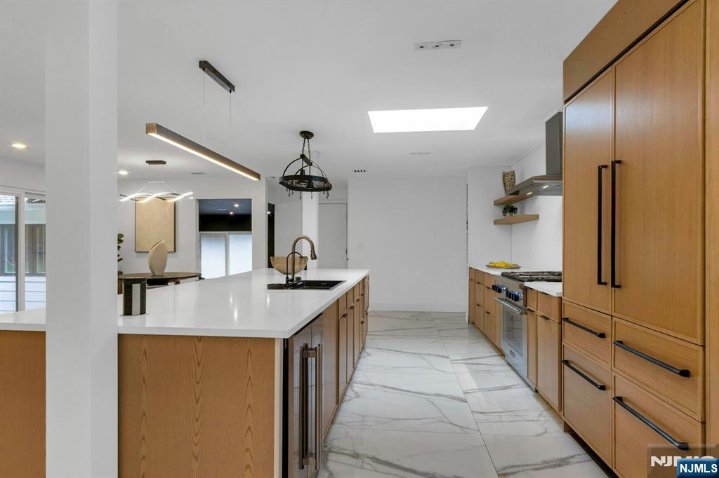 14 Rambling Brook Road Upper Saddle River, NJ 07458 - Photo 7 of 40 a kitchen with stainless steel appliances granite countertop a sink and a refrigerator