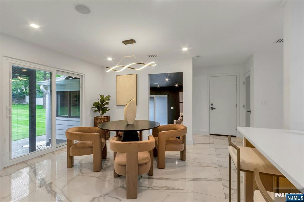 14 Rambling Brook Road Upper Saddle River, NJ 07458 - Photo 9 of 40 a living room with furniture and large windows