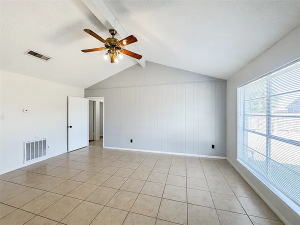 a view of an empty room and window