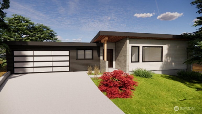 1108 9th Avenue South Edmonds, WA 98020 - Photo 9 of 11 a front view of a house with a yard and garage