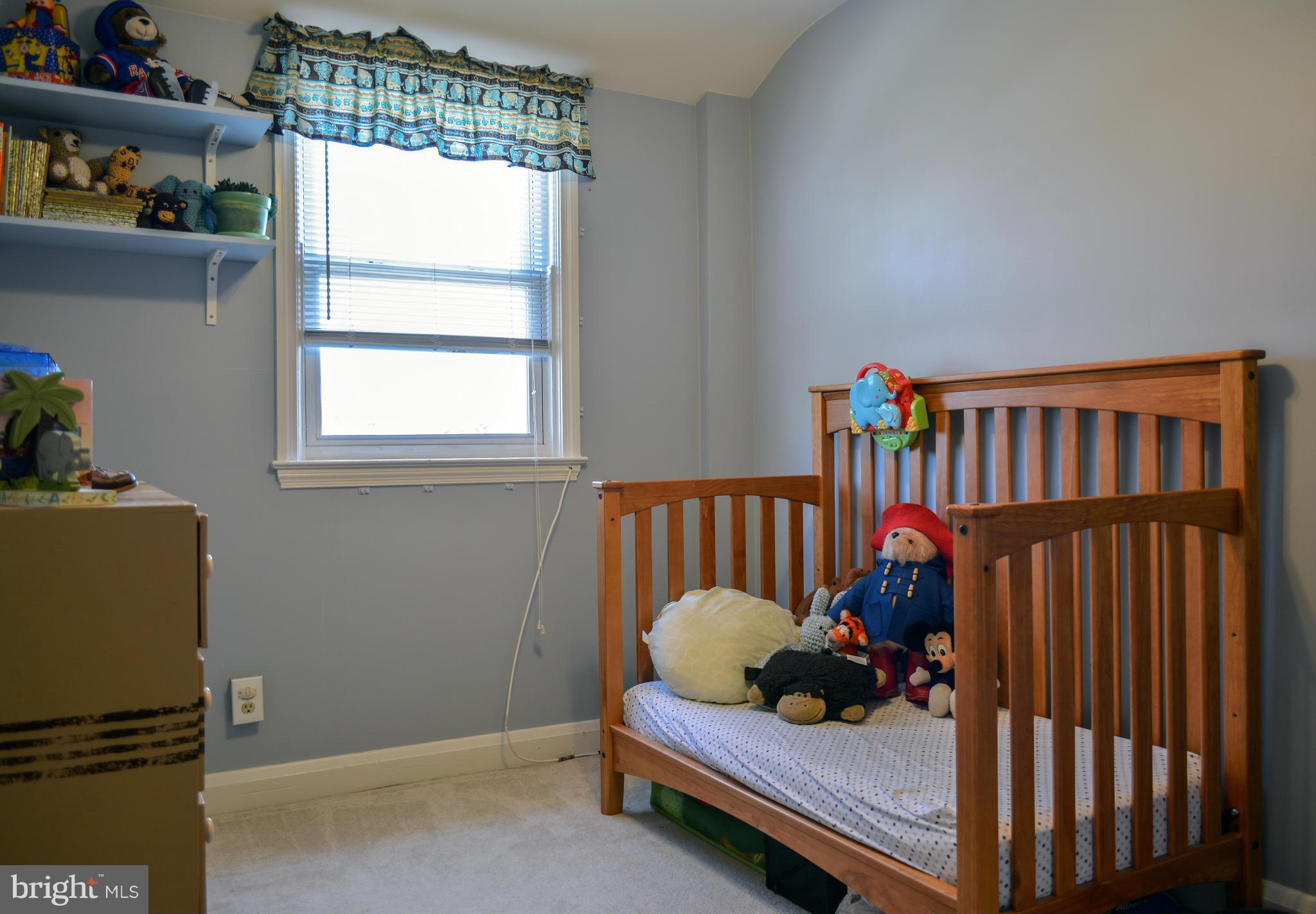 1604 Loch Ness Road Baltimore, MD 21286 - Photo 16 of 26 a bed room with furniture and a window