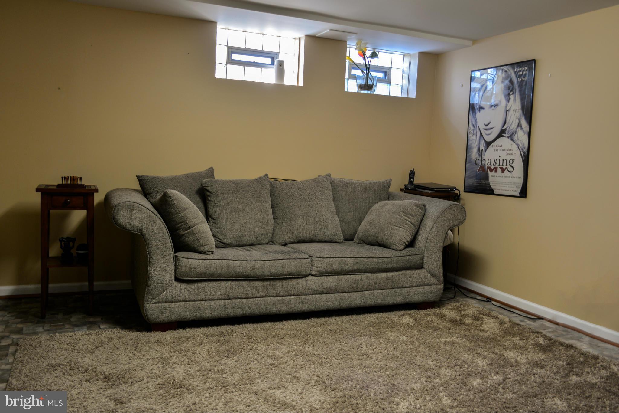 1604 Loch Ness Road Baltimore, MD 21286 - Photo 20 of 26 a living room with furniture and a couch