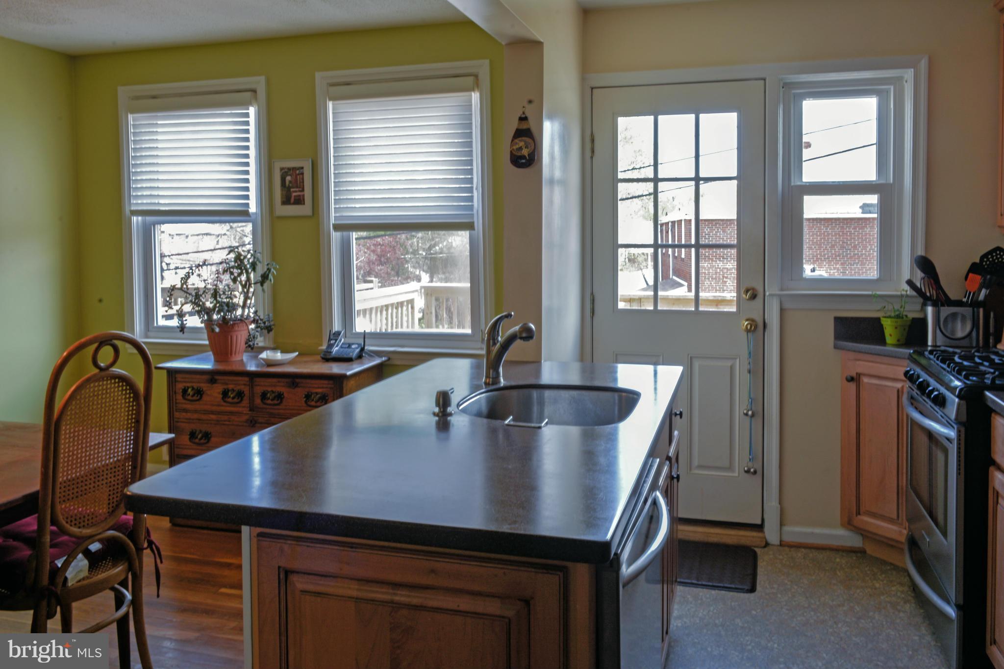 1604 Loch Ness Road Baltimore, MD 21286 - Photo 3 of 26 a kitchen with a table chairs and a window