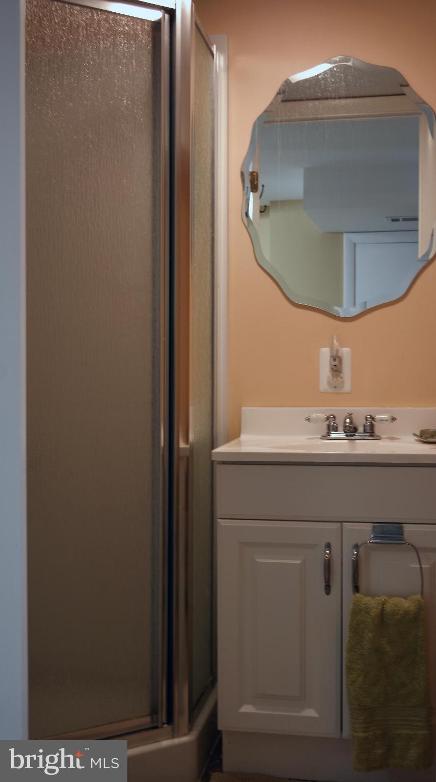 1604 Loch Ness Road Baltimore, MD 21286 - Photo 24 of 26 a bathroom with a sink a mirror and vanity