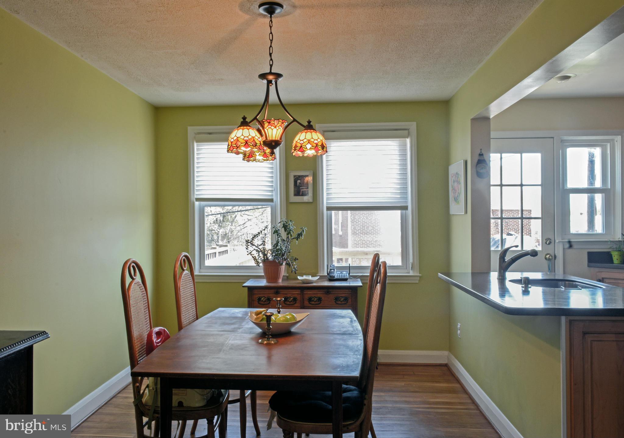 1604 Loch Ness Road Baltimore, MD 21286 - Photo 8 of 26 a dining room with furniture a chandelier and window