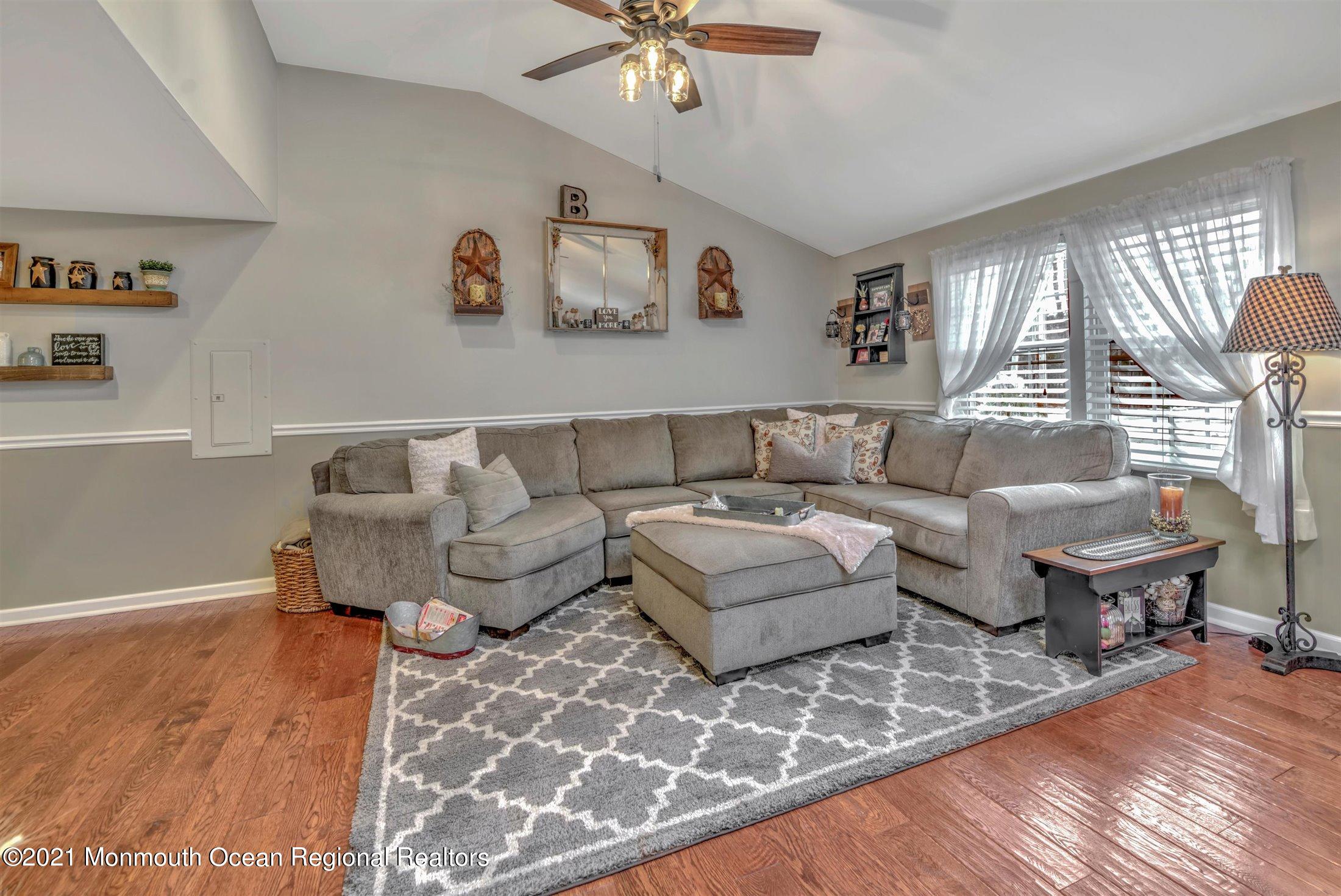 412 Conifer Drive Forked River, NJ 08731 - Photo 11 of 37 a living room with furniture and a large window