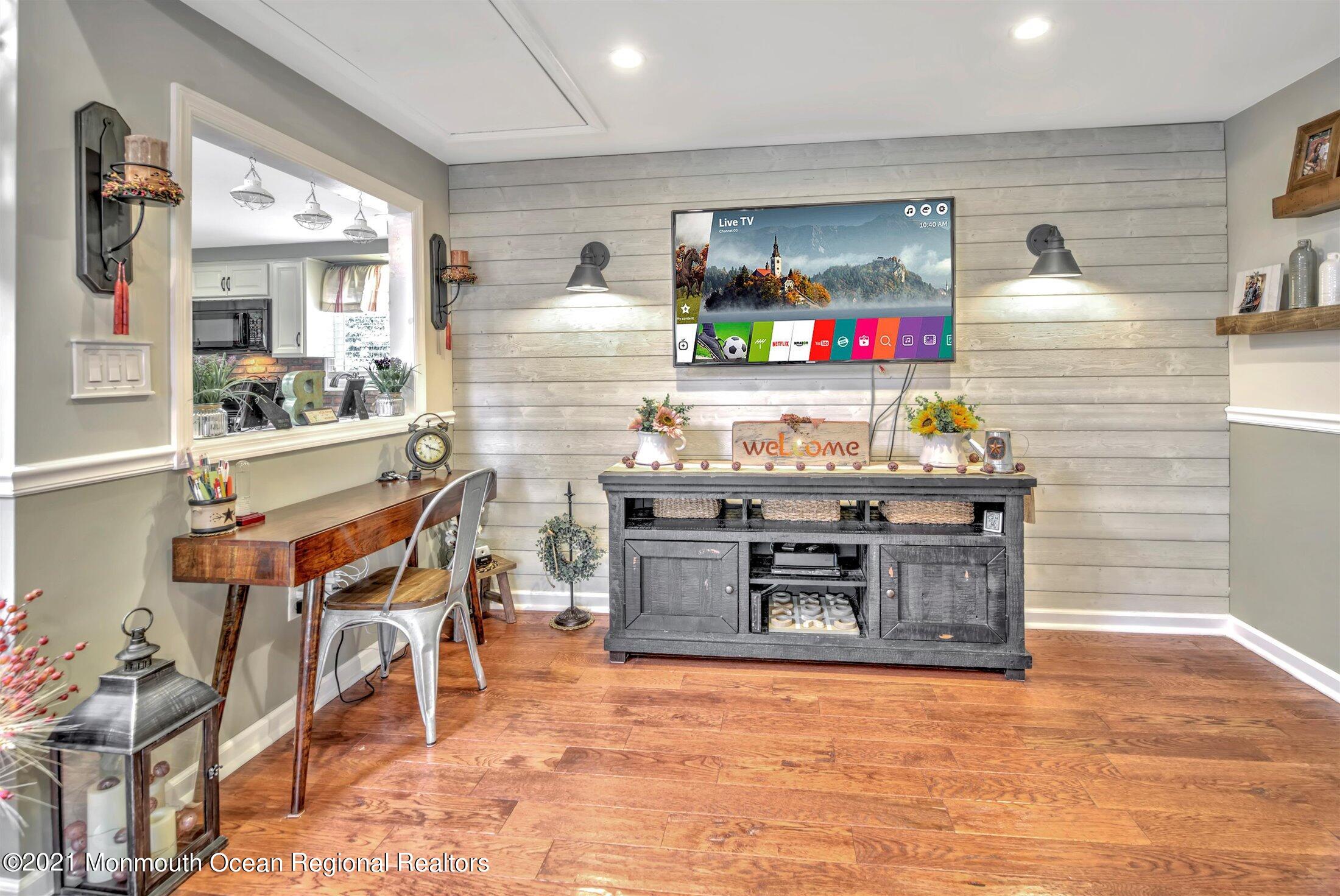 412 Conifer Drive Forked River, NJ 08731 - Photo 13 of 37 a kitchen with stainless steel appliances kitchen island granite countertop a stove and a sink