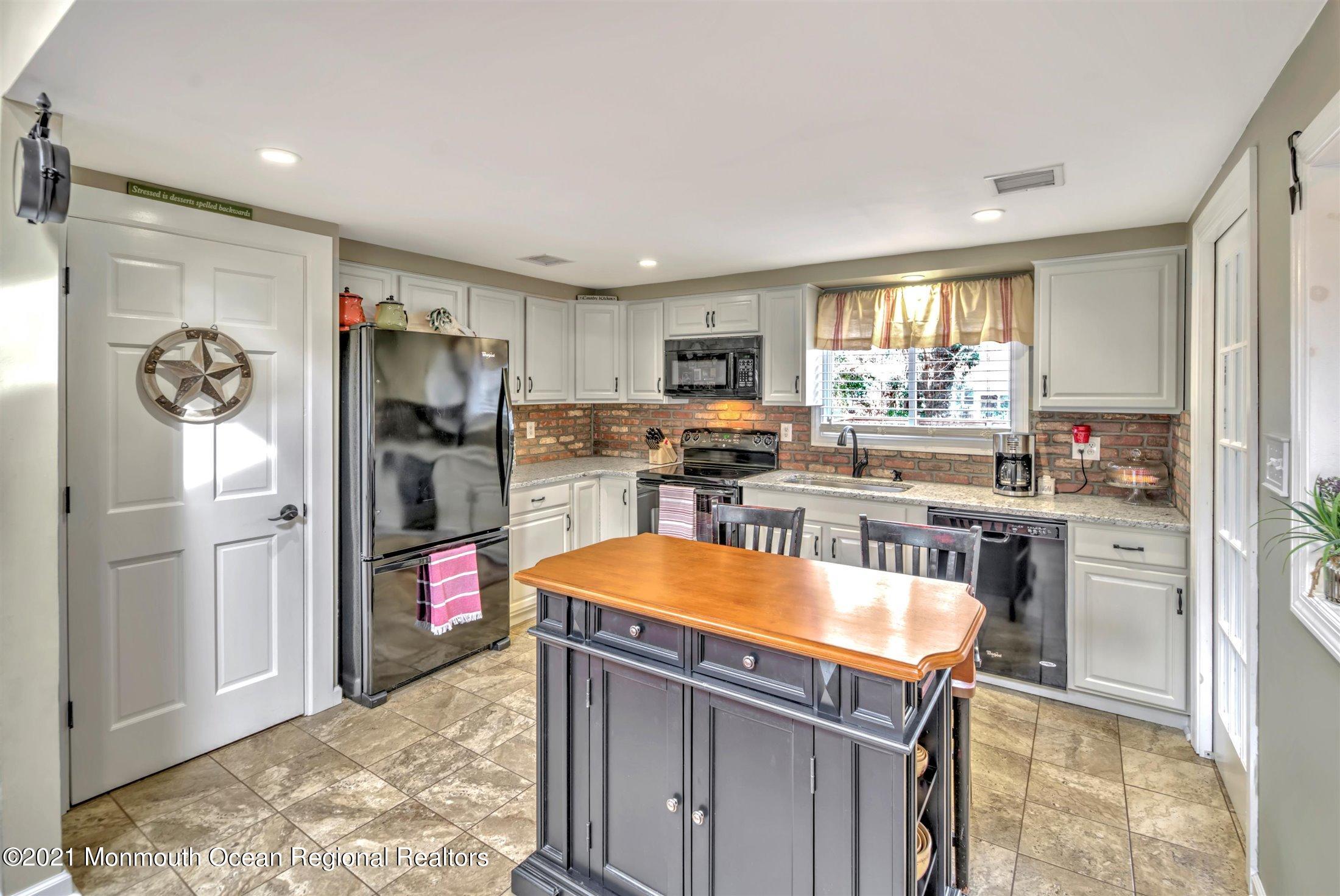 412 Conifer Drive Forked River, NJ 08731 - Photo 15 of 37 a kitchen with stainless steel appliances granite countertop a refrigerator and a stove top oven