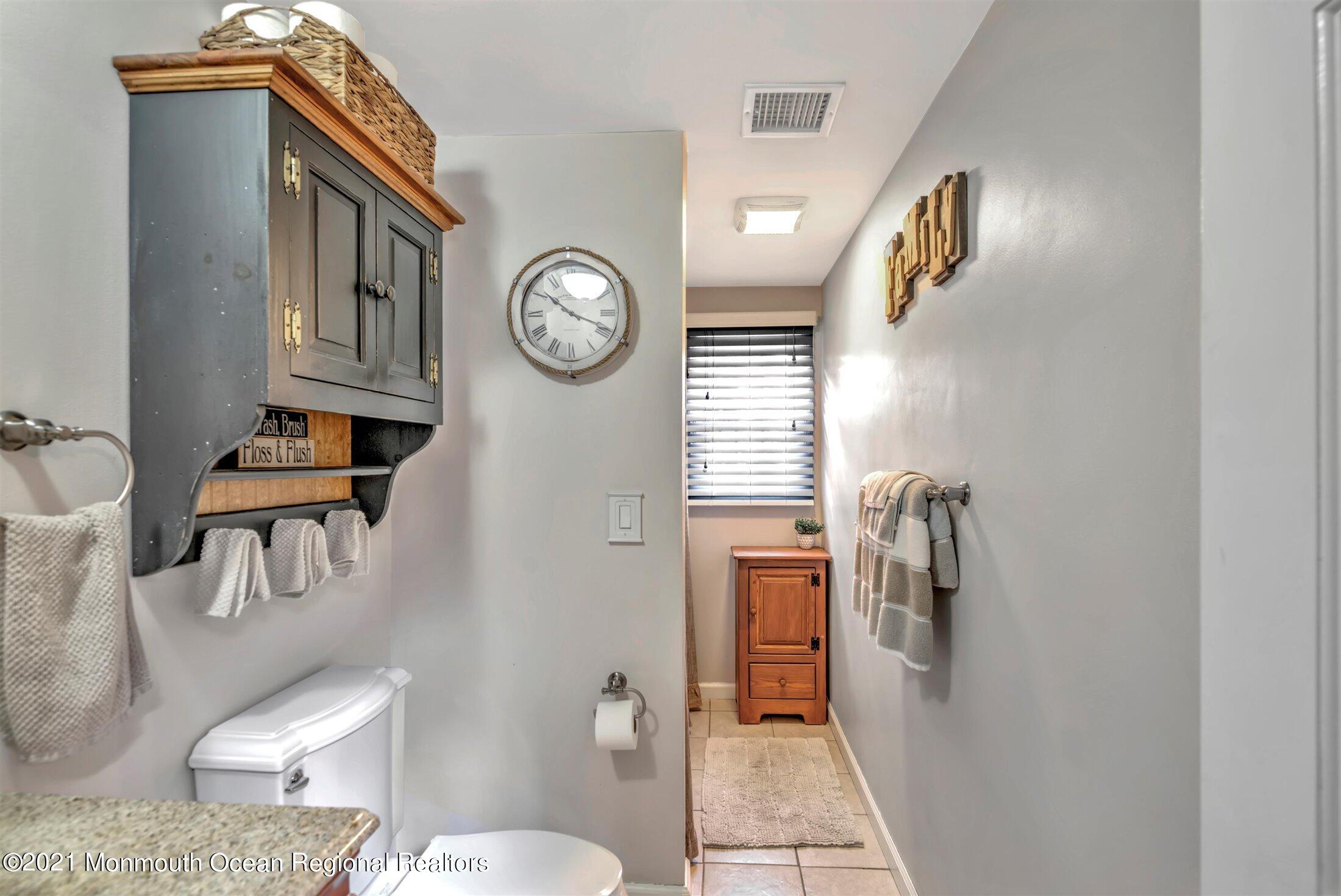 412 Conifer Drive Forked River, NJ 08731 - Photo 20 of 37 a living room with furniture and a window