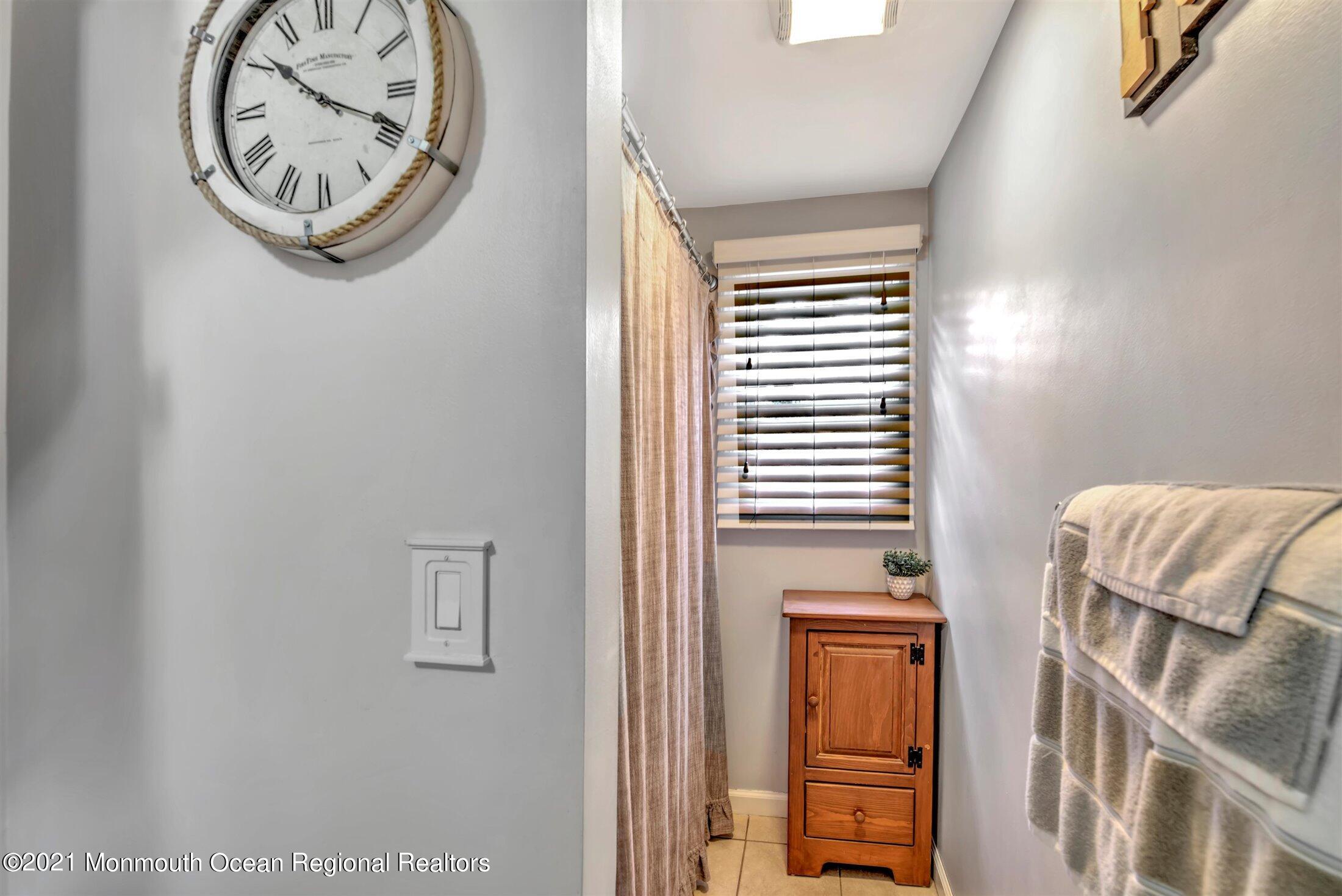 412 Conifer Drive Forked River, NJ 08731 - Photo 22 of 37 a view of a hallway with elevator and a window