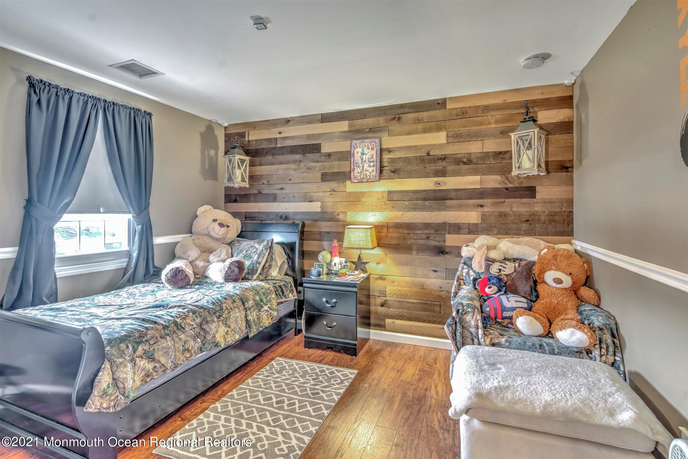 412 Conifer Drive Forked River, NJ 08731 - Photo 25 of 37 a bedroom with a bed and a window