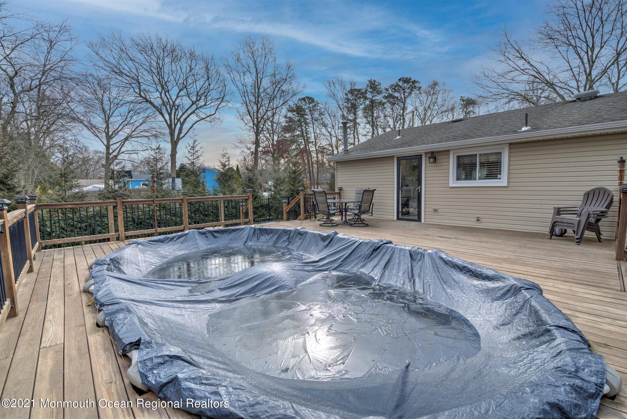 412 Conifer Drive Forked River, NJ 08731 - Photo 30 of 37 a view of a house with backyard and sitting area