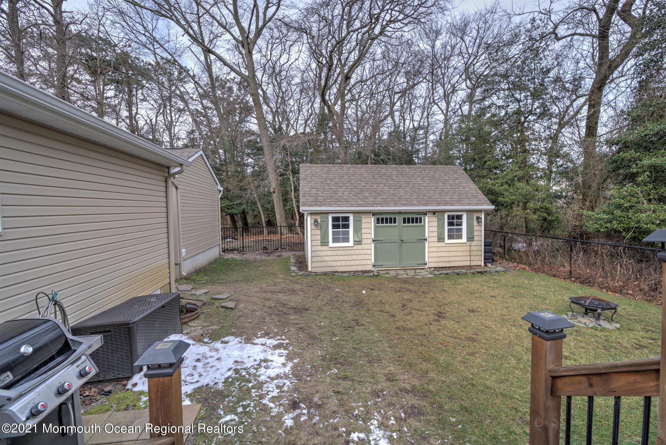 412 Conifer Drive Forked River, NJ 08731 - Photo 31 of 37 a house with trees in the background