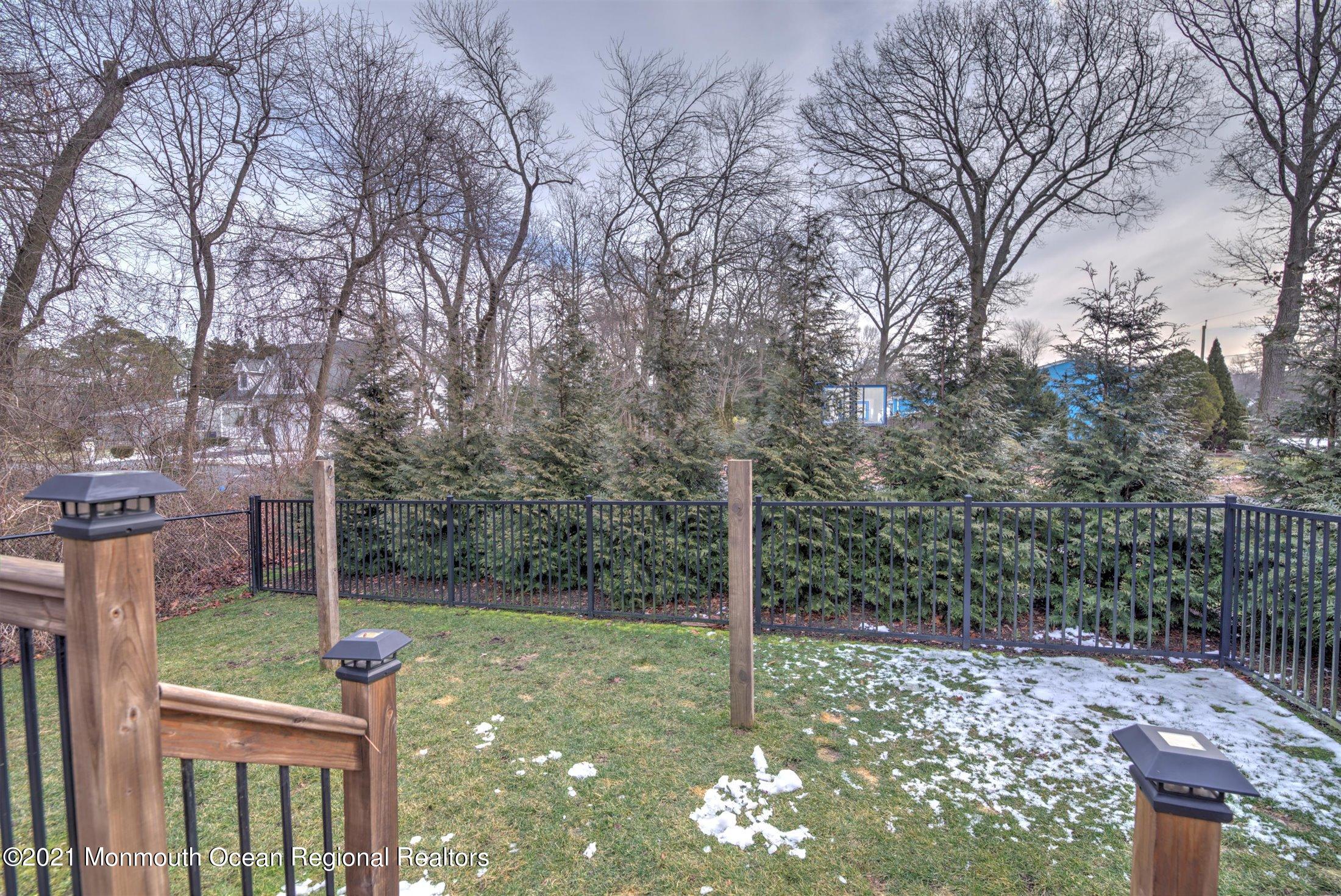 412 Conifer Drive Forked River, NJ 08731 - Photo 32 of 37 a backyard of a house with lots of green space