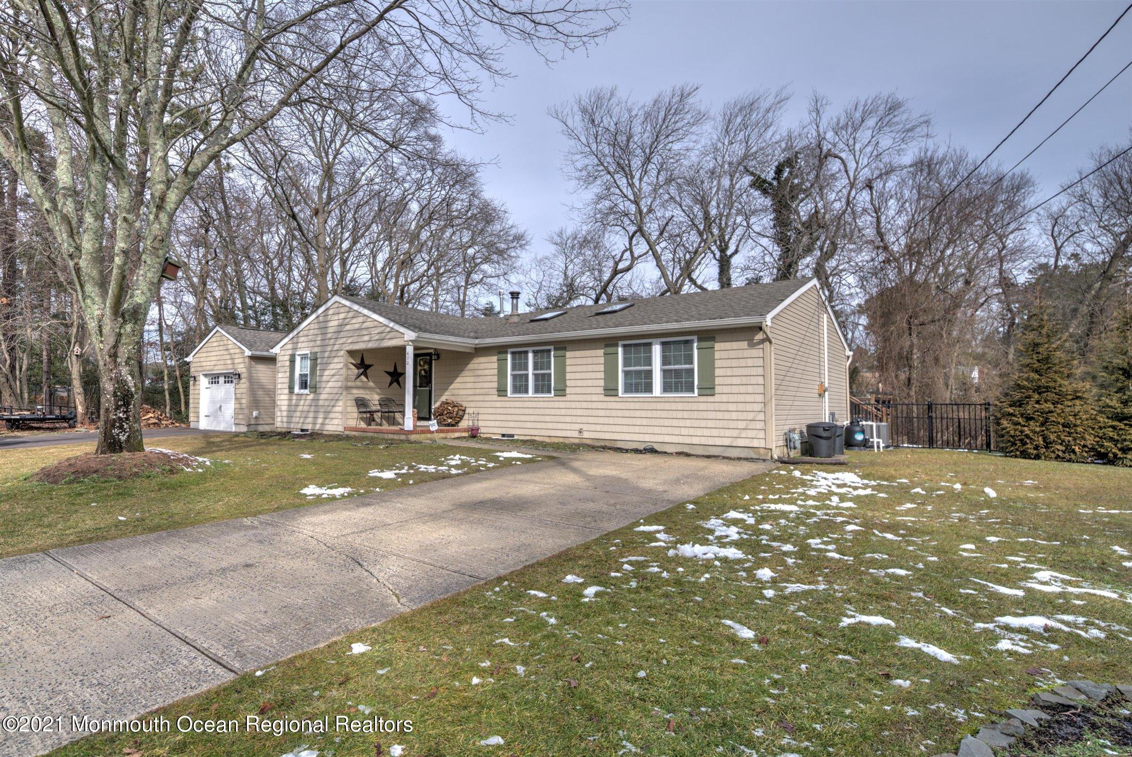 412 Conifer Drive Forked River, NJ 08731 - Photo 36 of 37 a front view of a house with garden