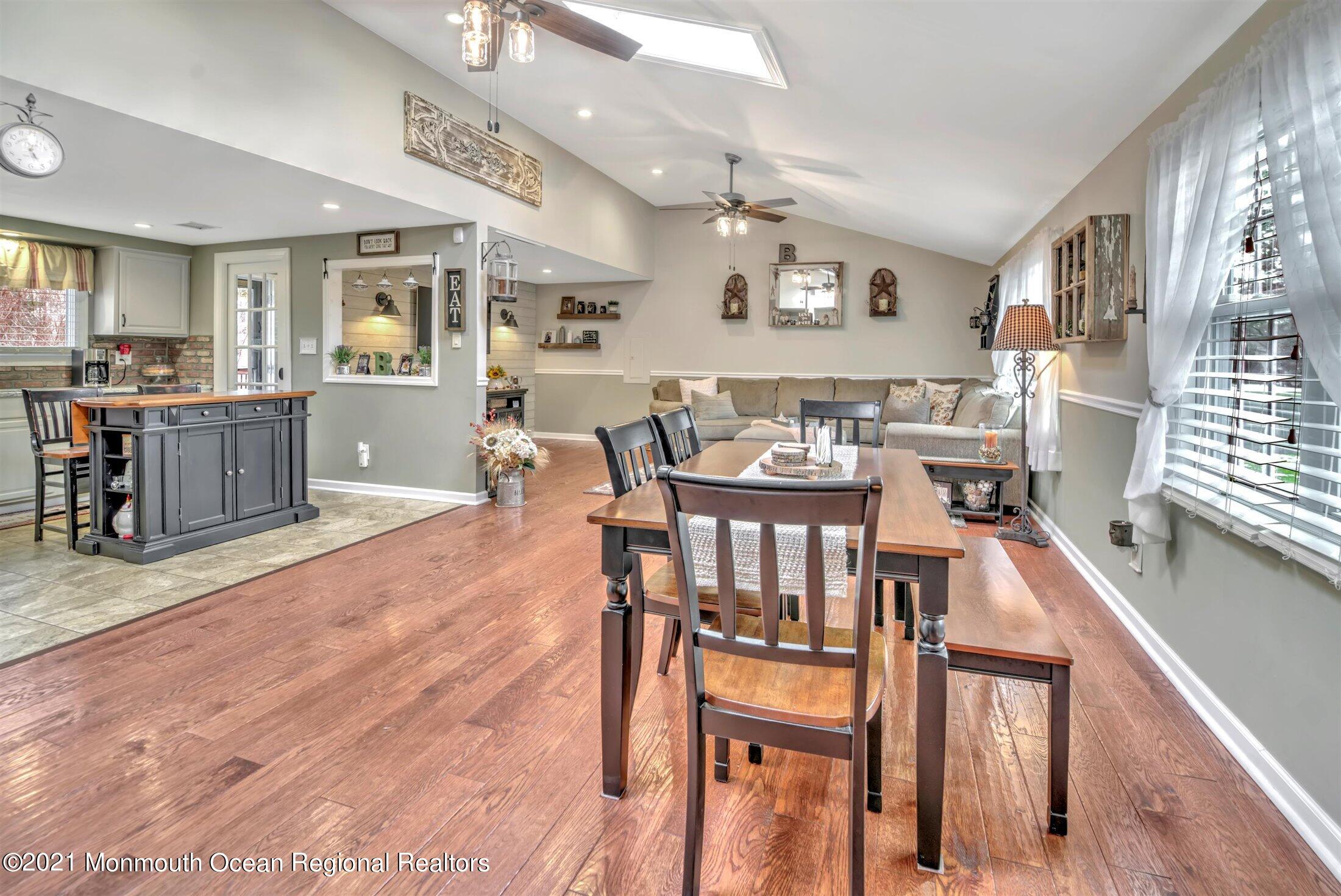 412 Conifer Drive Forked River, NJ 08731 - Photo 7 of 37 a view of a dining room with furniture and wooden floor