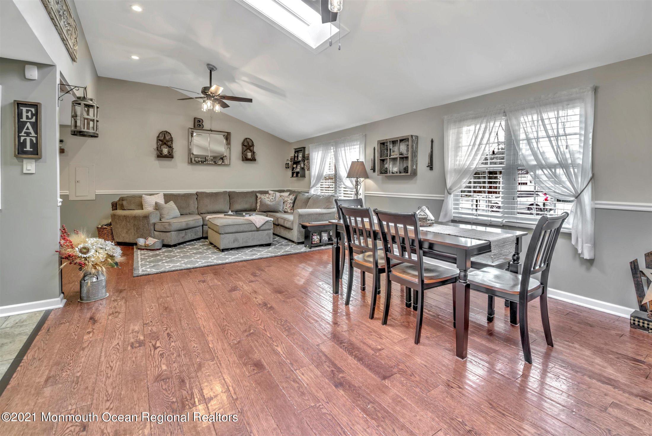412 Conifer Drive Forked River, NJ 08731 - Photo 8 of 37 a view of a dining room with furniture window and wooden floor