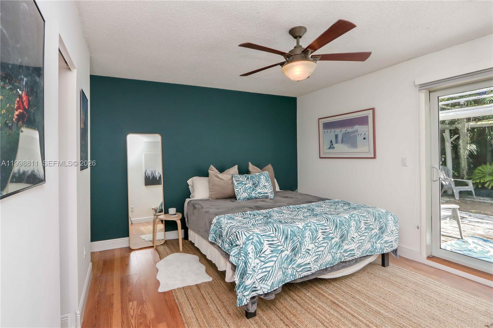 3155 Jackson Avenue Miami, FL 33133 - Photo 11 of 20 a bedroom with a bed and window