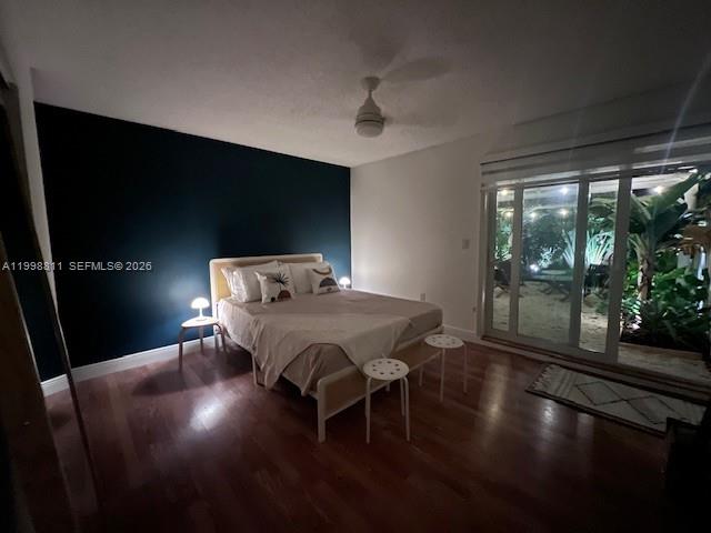 3155 Jackson Avenue Miami, FL 33133 - Photo 13 of 20 a view of a dining room with furniture wooden floor and front door