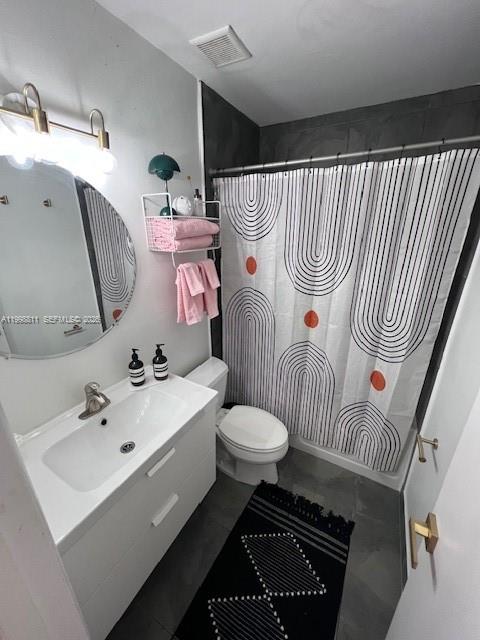 3155 Jackson Avenue Miami, FL 33133 - Photo 16 of 20 a bathroom with a sink toilet and shower