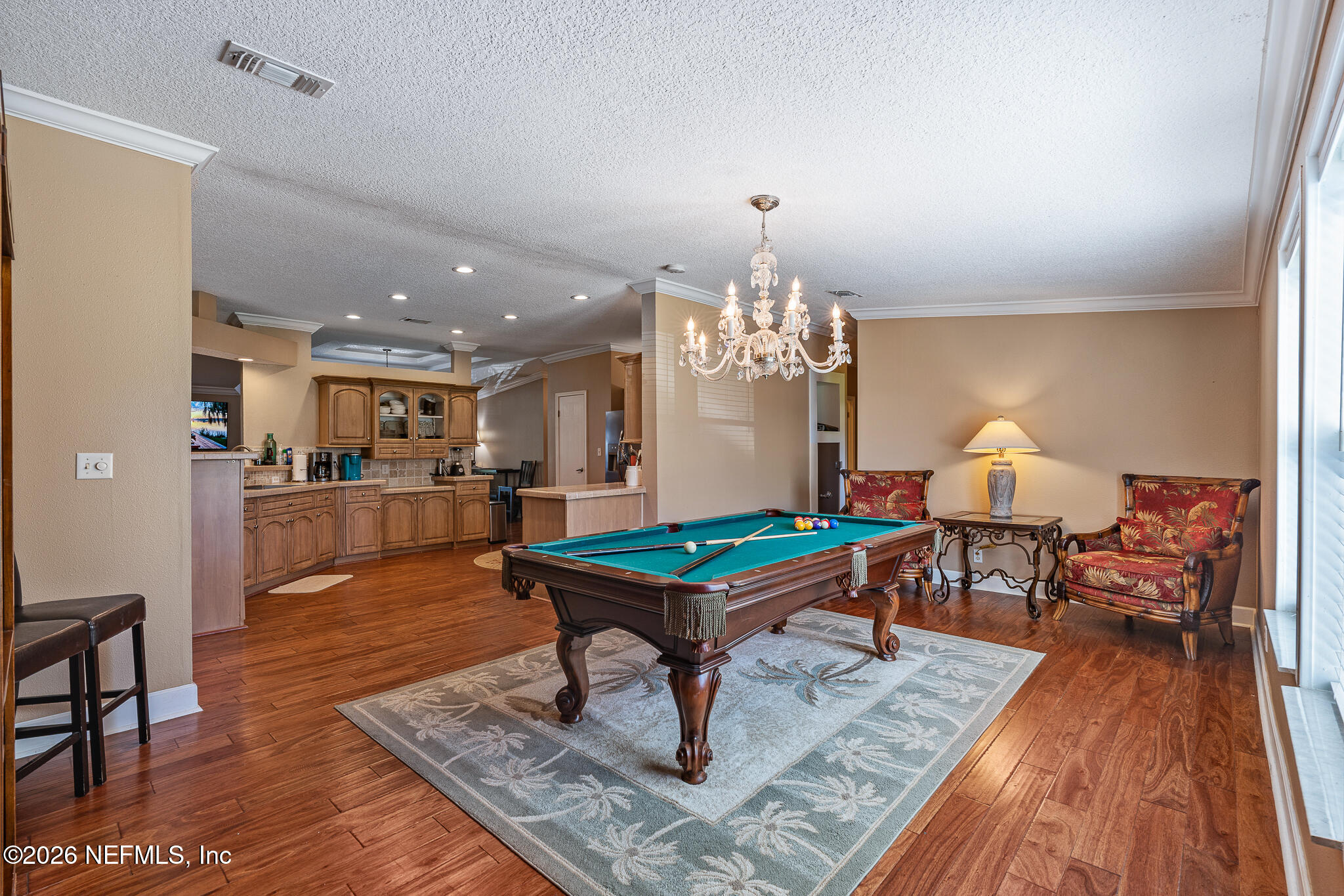 105 South Lake George Drive Georgetown, FL 32139 - Photo 12 of 30 a living room with furniture dining table a rug and a chandelier