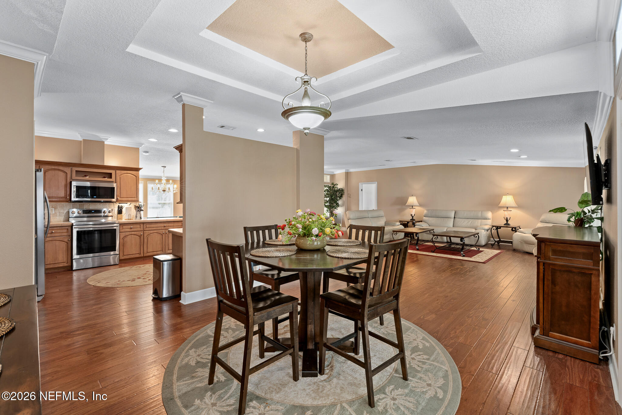 105 South Lake George Drive Georgetown, FL 32139 - Photo 13 of 30 a view of a dining room with furniture wooden floor and chandelier