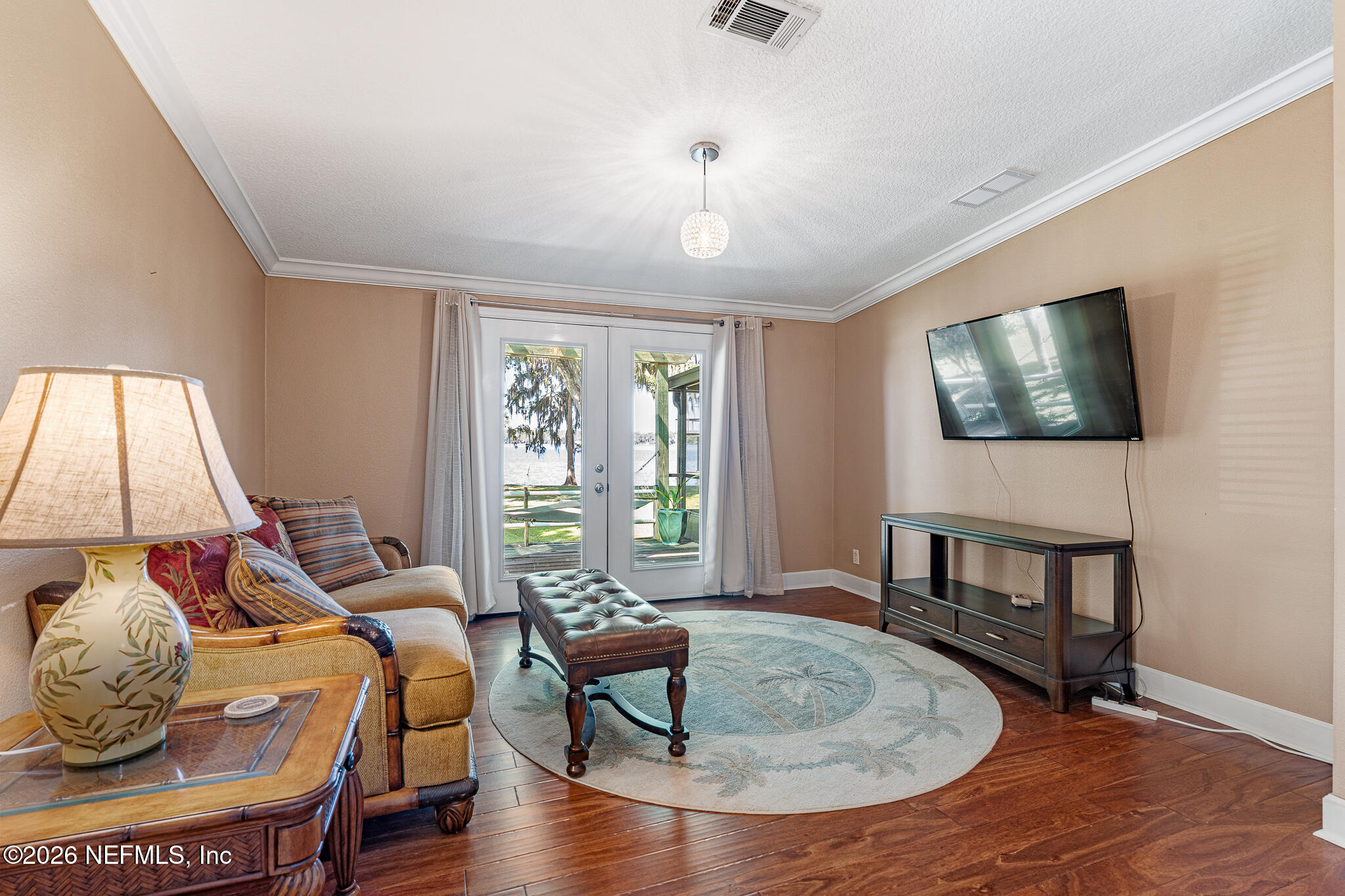 105 South Lake George Drive Georgetown, FL 32139 - Photo 17 of 30 a living room with furniture and a flat screen tv