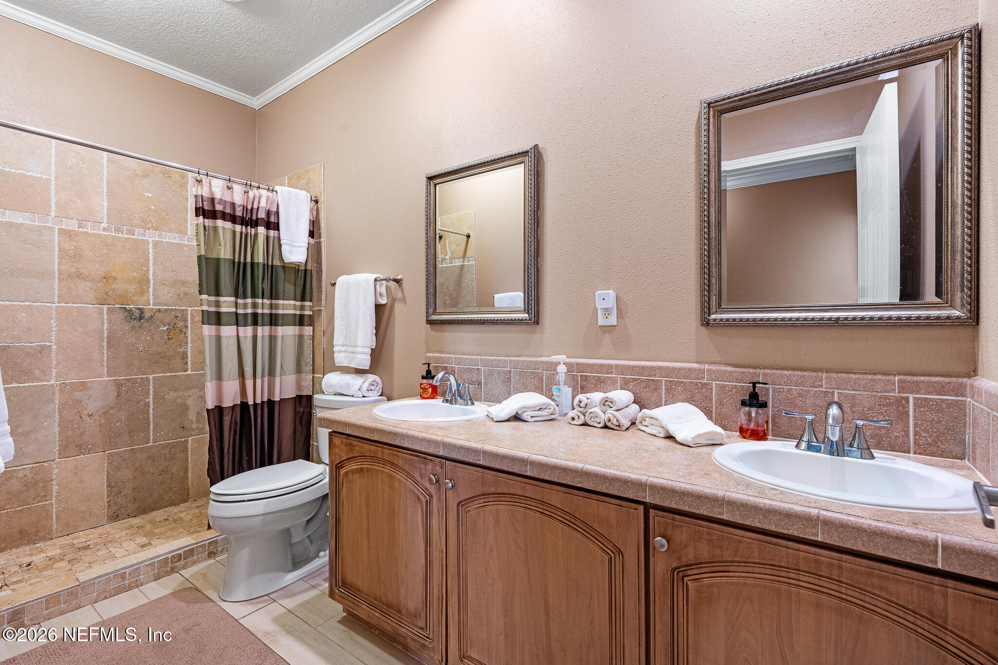 105 South Lake George Drive Georgetown, FL 32139 - Photo 22 of 30 a bathroom with a double vanity sink toilet and shower