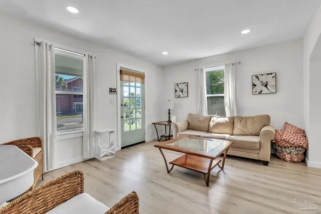 a living room with furniture and a window