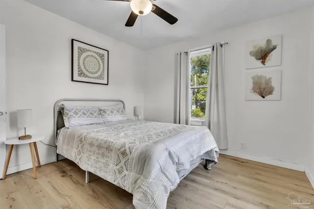a bedroom with bed and window