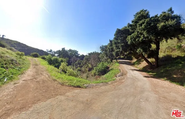 a view of backyard with green space