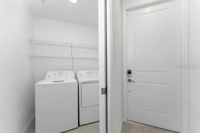 a bedroom with a bed and a desk