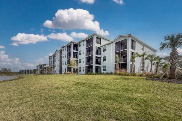 a view of multiple houses with a yard