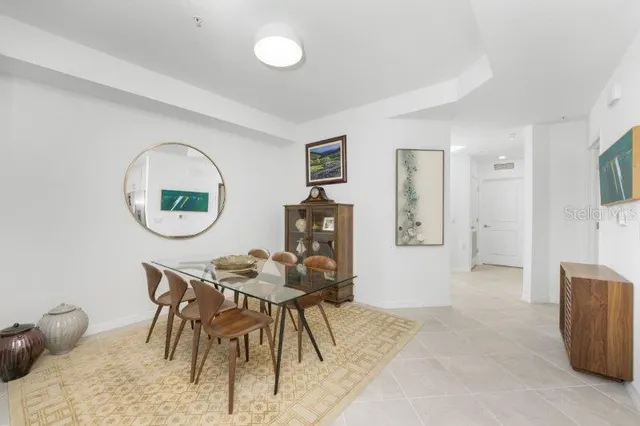 a view of a livingroom with furniture and a window