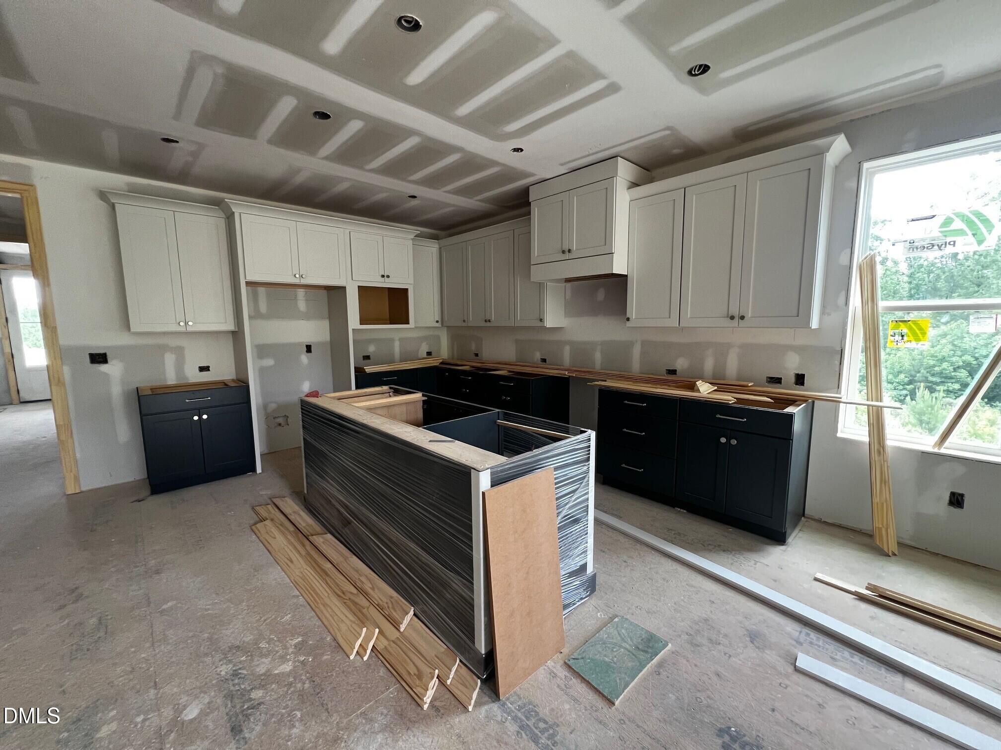 1675 Terry Road Durham, NC 27712 - Photo 4 of 23 a kitchen with a sink and cabinets