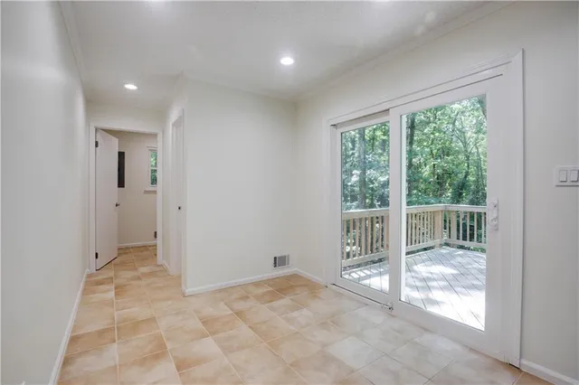 a view of an empty room and window