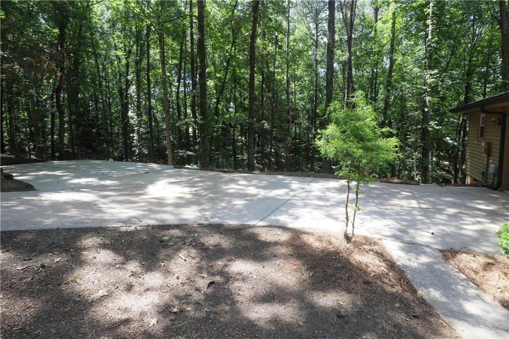 765 Spring Valley Drive Cumming, GA 30041 - Photo 27 of 31 a street view with yard