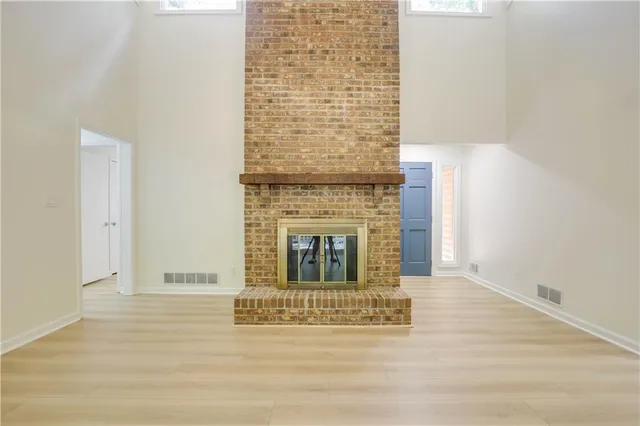 a view of fireplace with wooden floor