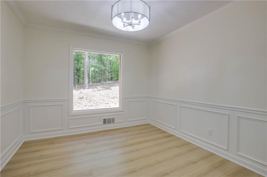 765 Spring Valley Drive Cumming, GA 30041 - Photo 9 of 31 an empty room with a window