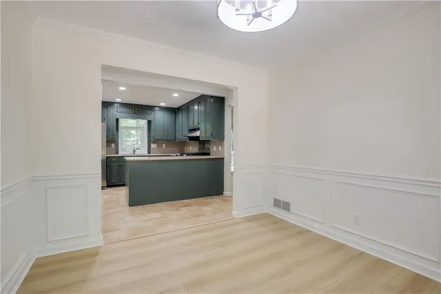 a view of kitchen with wooden floor