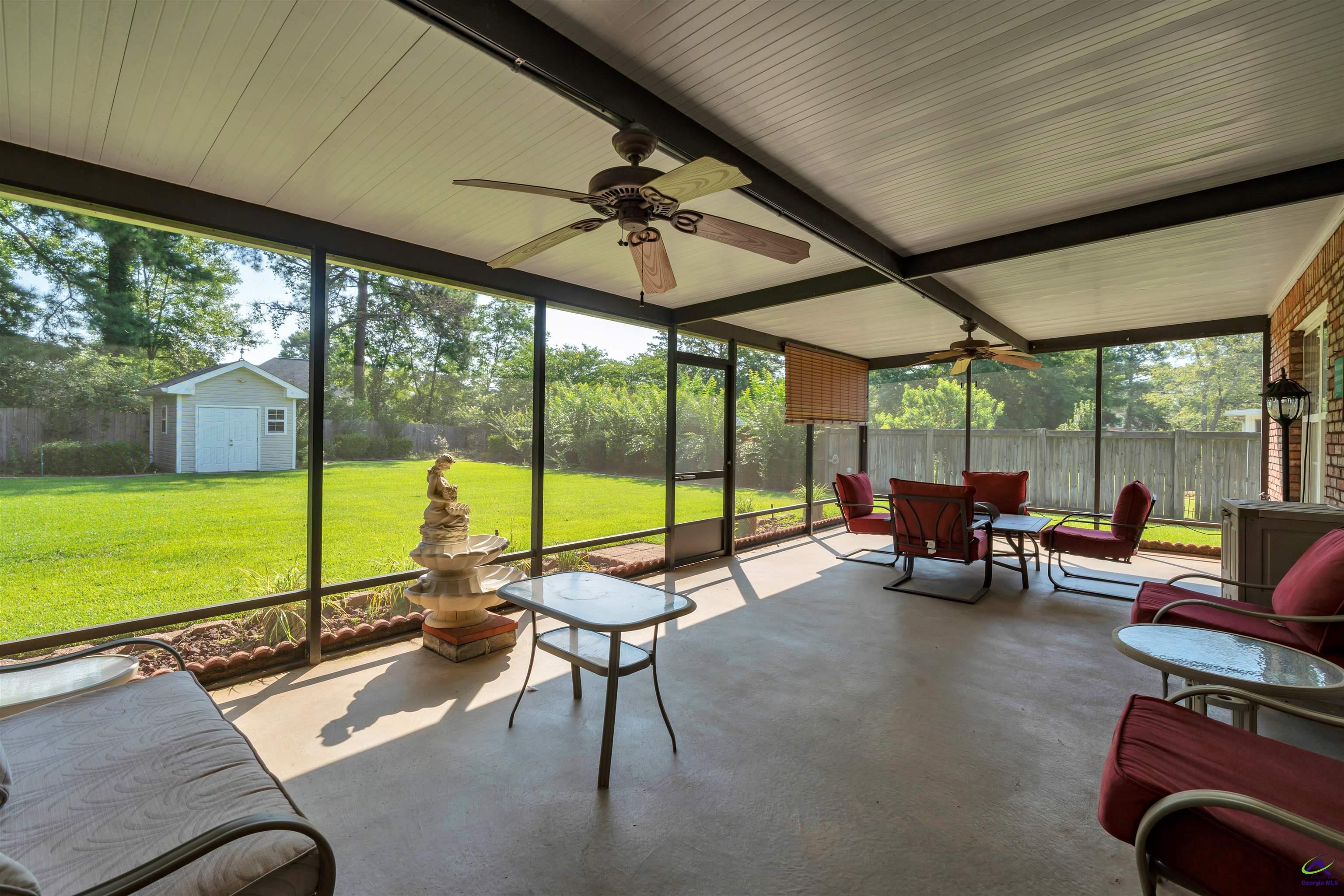 206 North Hampton Place Perry, GA 31069 - Photo 12 of 20 a living room with furniture and floor to ceiling windows