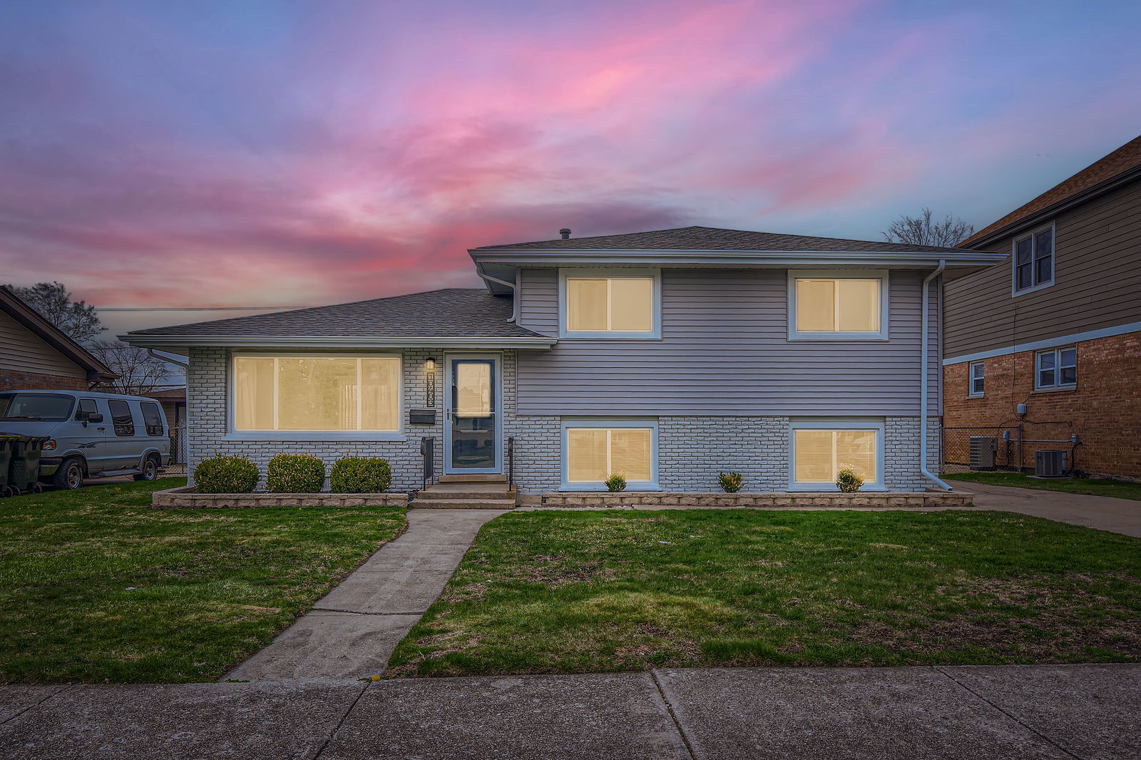 10403 Barnard Drive Chicago Ridge, IL 60415 - Photo 1 of 25 a front view of a house with a yard