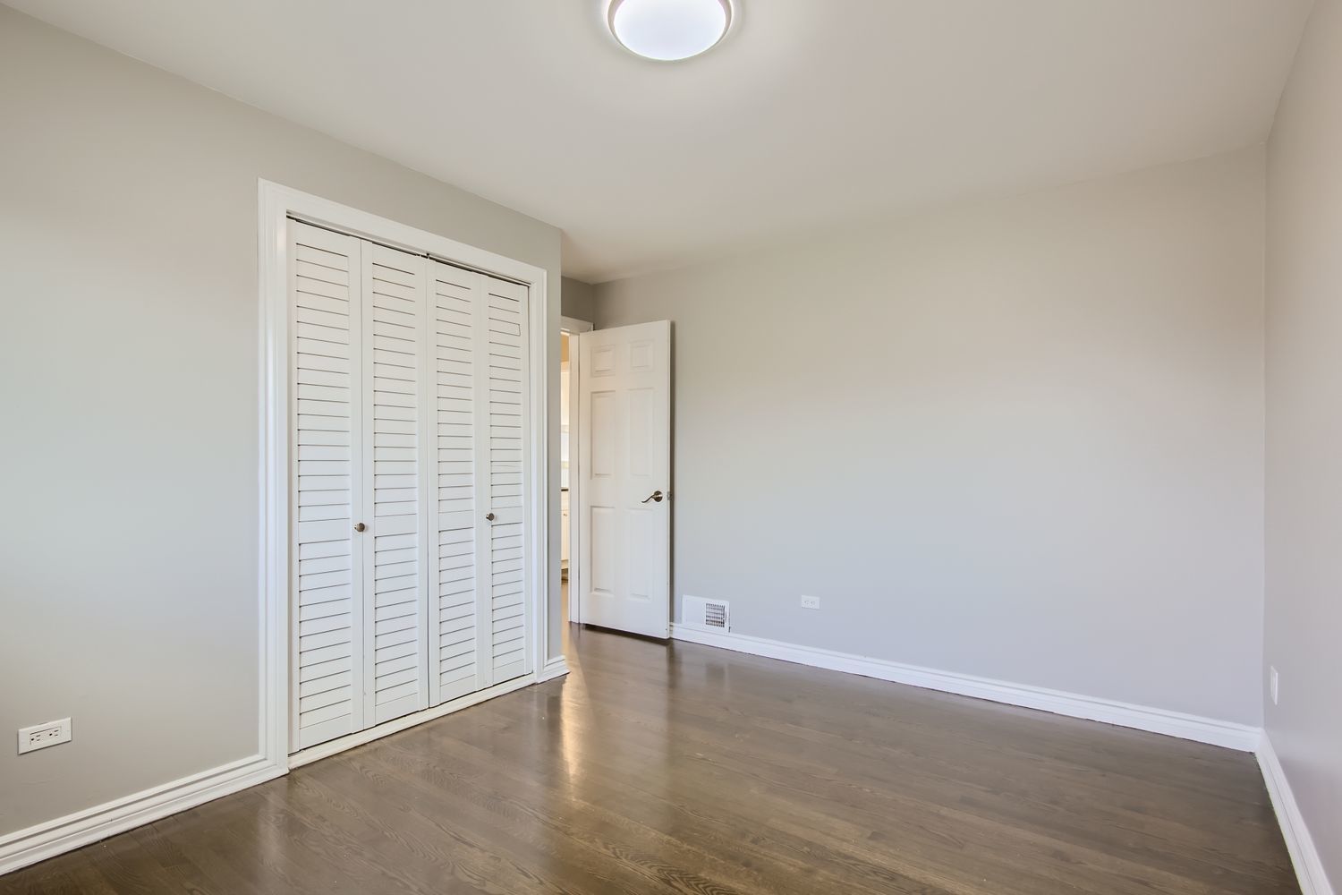 10403 Barnard Drive Chicago Ridge, IL 60415 - Photo 12 of 25 an empty room with wooden floor and windows