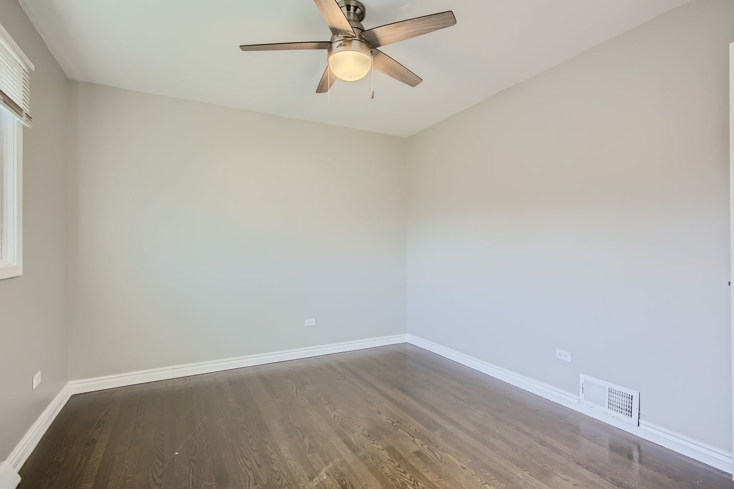 10403 Barnard Drive Chicago Ridge, IL 60415 - Photo 14 of 25 an empty room with a window and a ceiling fan