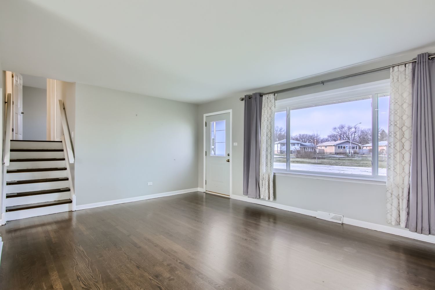 10403 Barnard Drive Chicago Ridge, IL 60415 - Photo 5 of 25 wooden floor in an empty room with a window