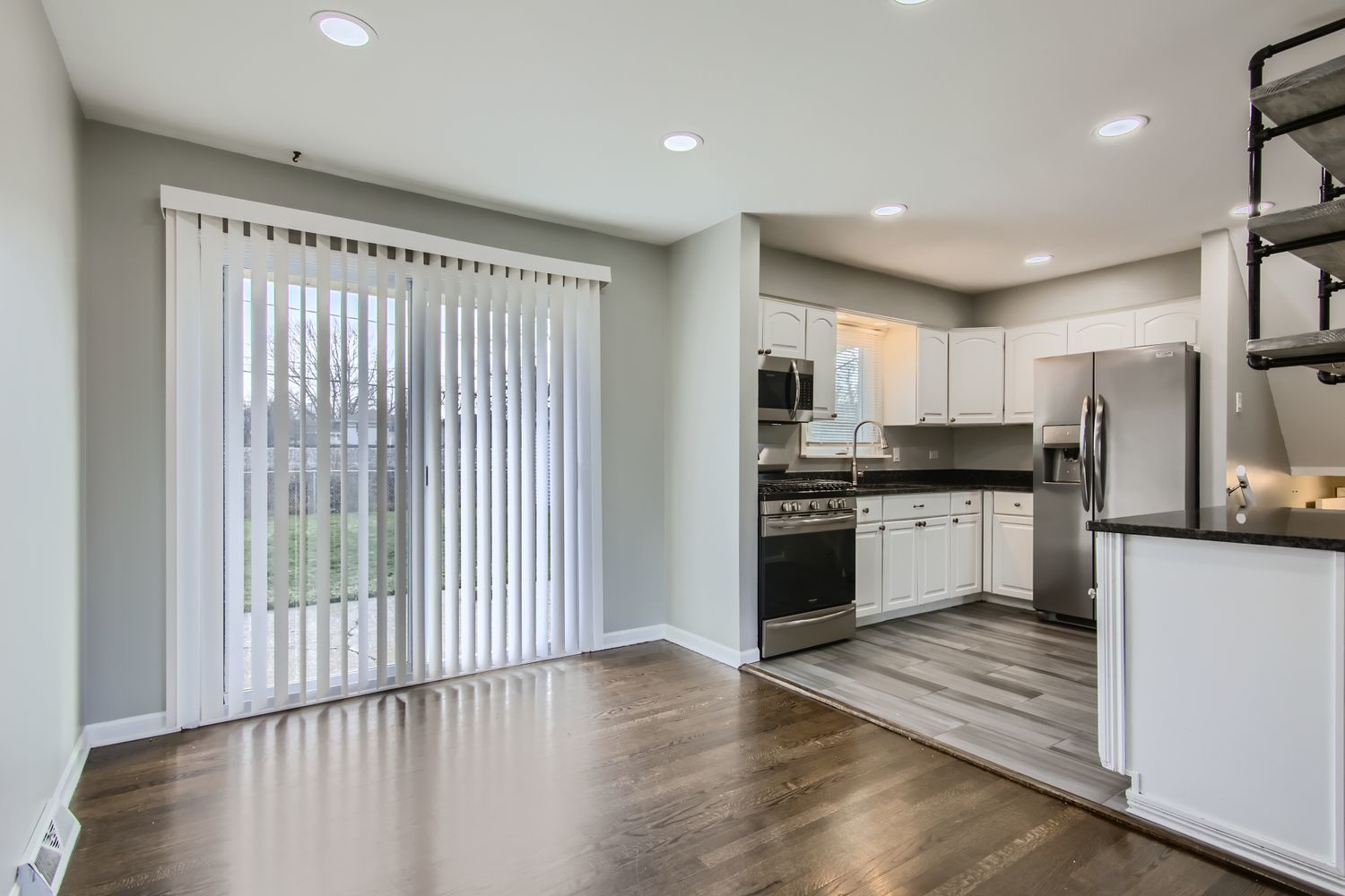 10403 Barnard Drive Chicago Ridge, IL 60415 - Photo 6 of 25 a kitchen with a refrigerator and white cabinets
