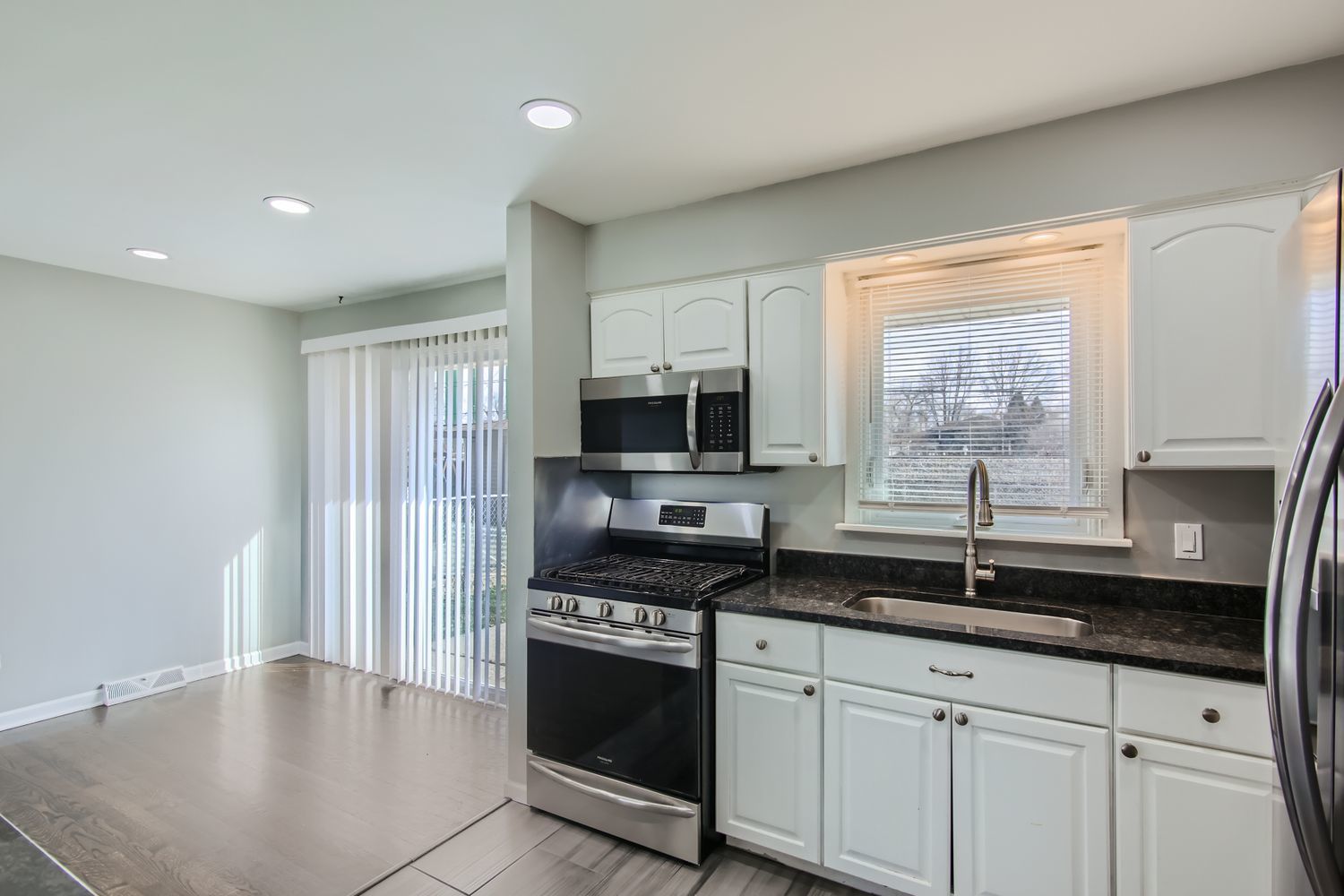 10403 Barnard Drive Chicago Ridge, IL 60415 - Photo 7 of 25 a kitchen with granite countertop a sink and a stove top oven