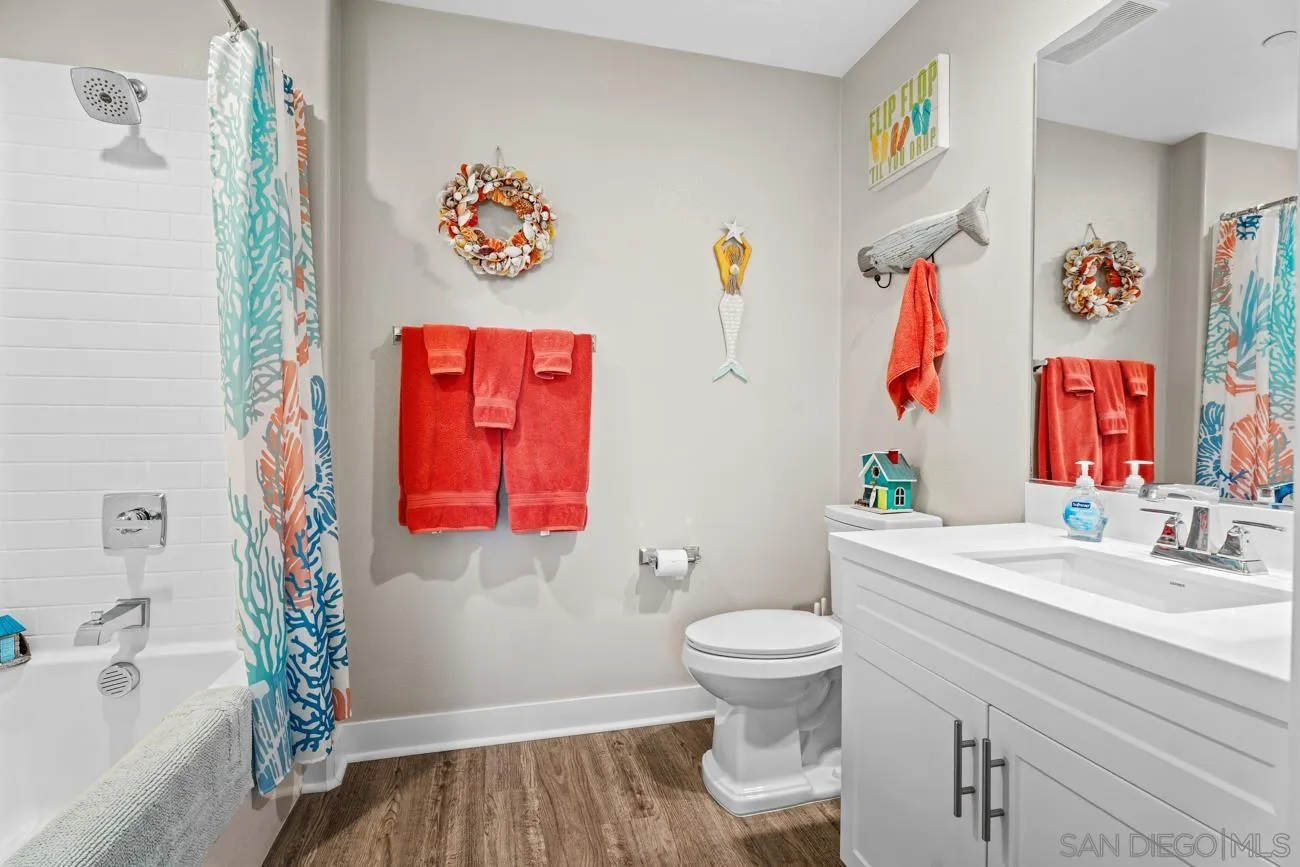 4326 Star Path Way, Unit 1 Oceanside, CA 92056 - Photo 9 of 46 a bathroom with a sink toilet and a bathtub