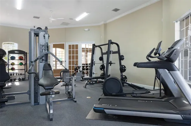 a swimming pool view with a seating space and a garden