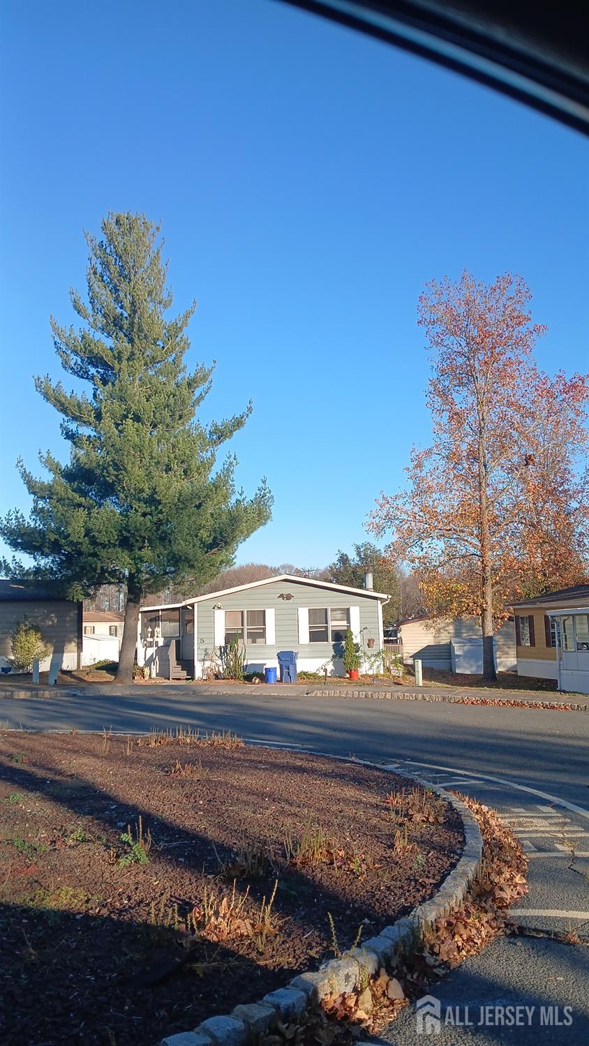 5 Morley Road North Brunswick, NJ 08902 - Photo 1 of 16 a front view of a house with a yard